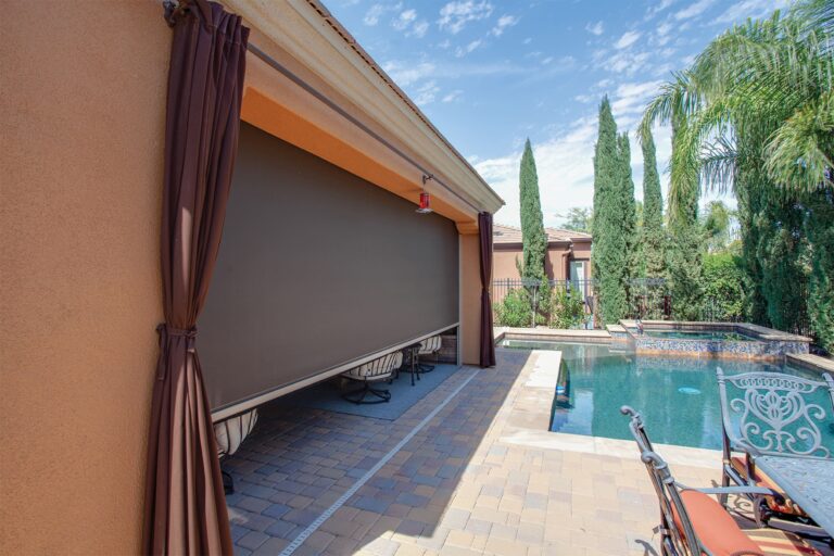 An outdoor shade screen covering a back patio.